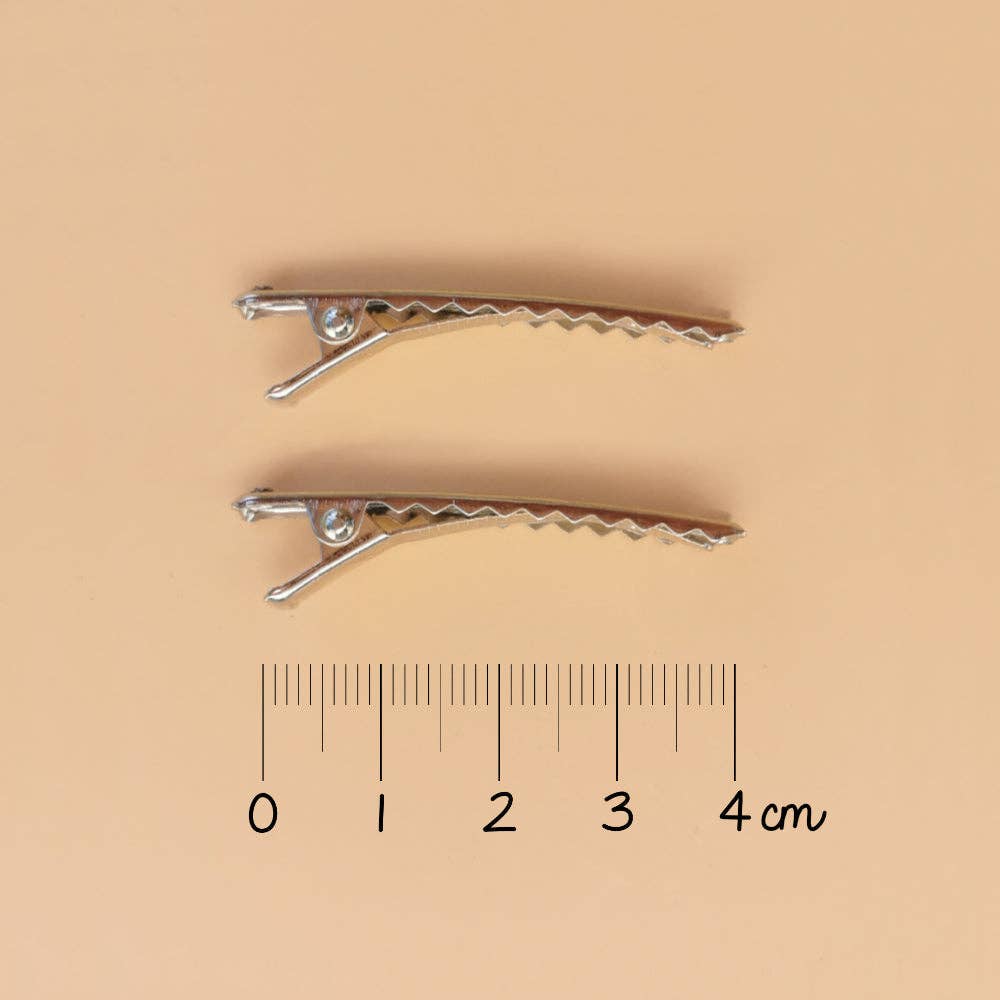 Goldfarbene Mini-Haarspangen mit Muschelmuster (Paar)